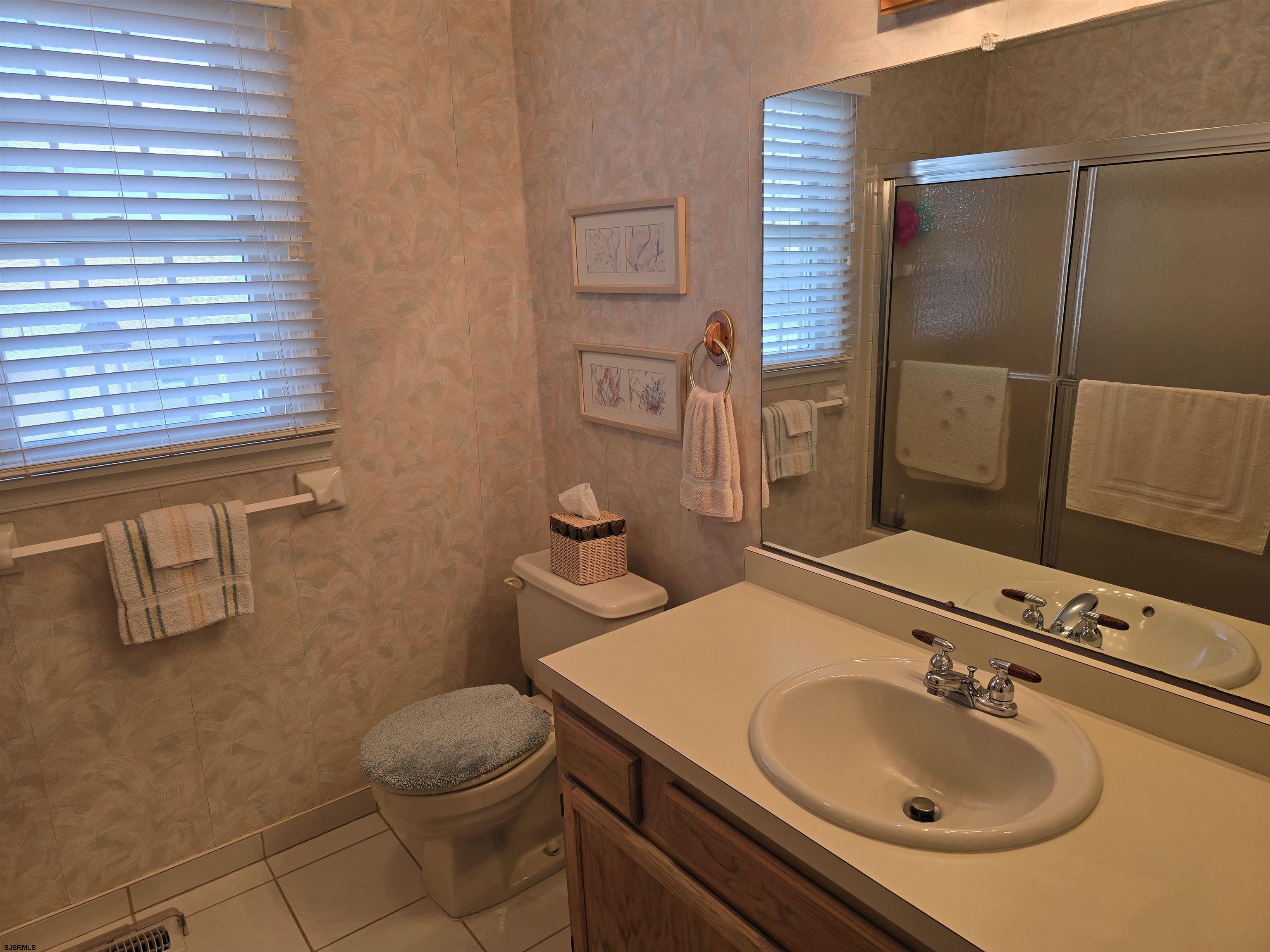 9 Gull Cove Brigantine, NJ 08203 - Photo 20 of 20 a bathroom with a sink toilet and shower