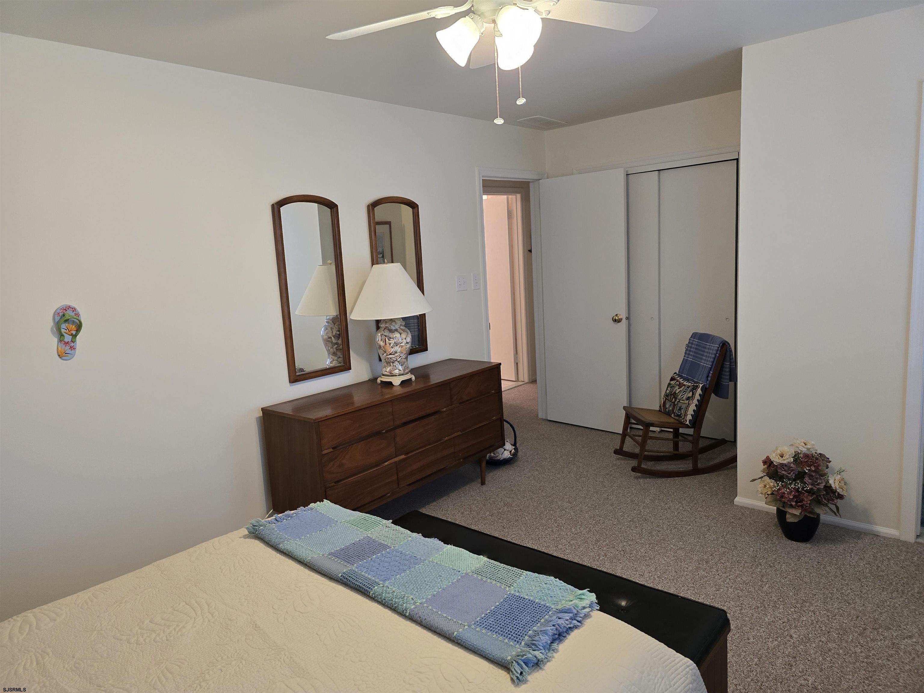 9 Gull Cove Brigantine, NJ 08203 - Photo 3 of 20 a bed room with furniture and a chandelier