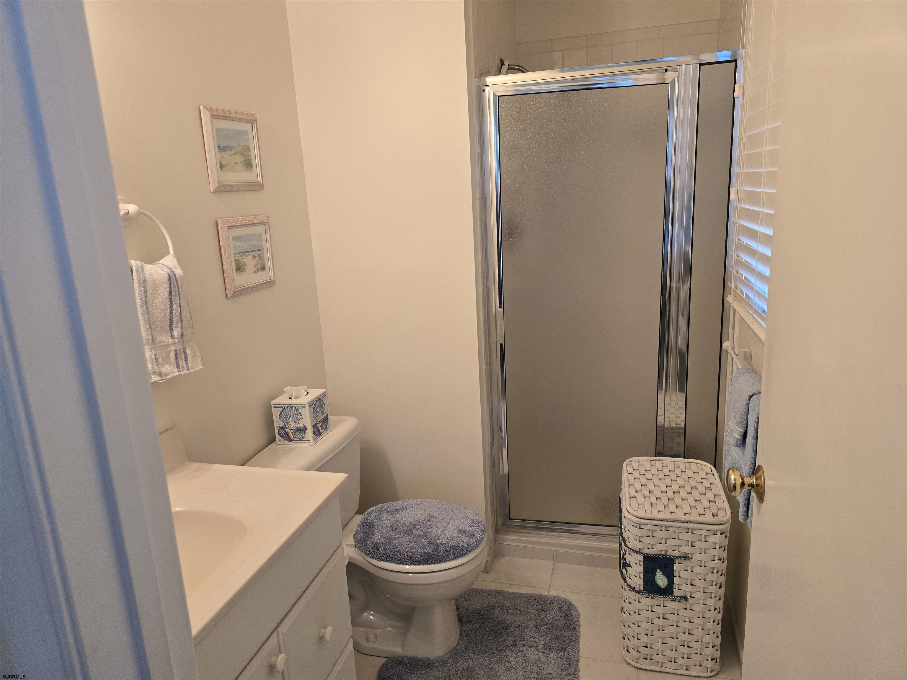 9 Gull Cove Brigantine, NJ 08203 - Photo 4 of 20 a bathroom with a toilet and a sink
