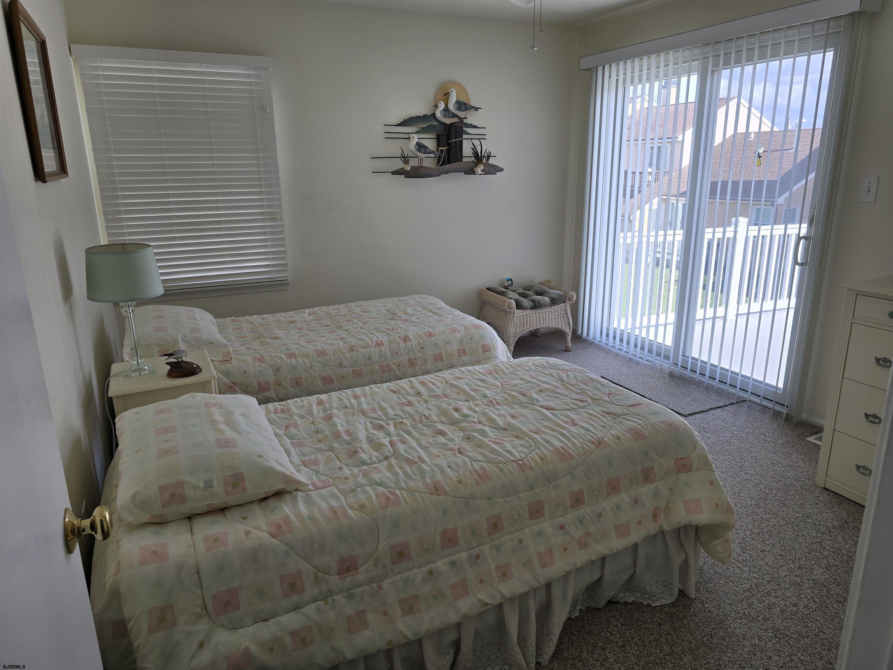 9 Gull Cove Brigantine, NJ 08203 - Photo 5 of 20 a bedroom with a bed and a window