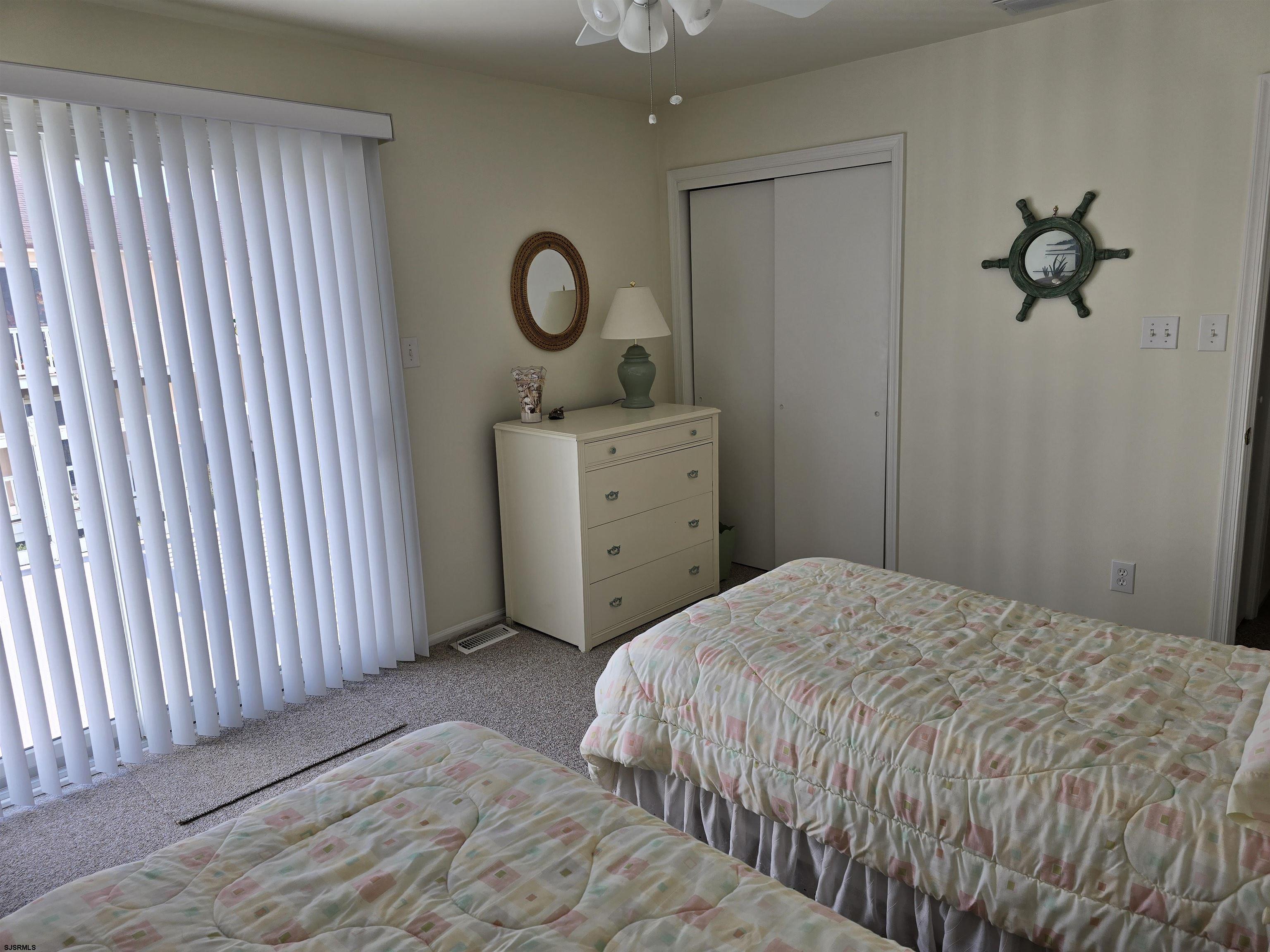9 Gull Cove Brigantine, NJ 08203 - Photo 6 of 20 a bedroom with a bed and cabinets