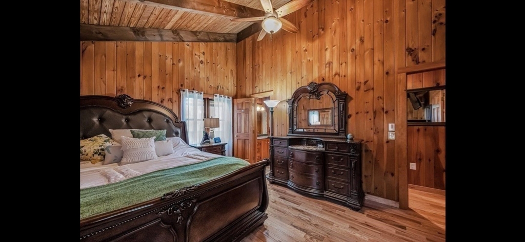 1828 East Otis Road Otis, MA 01029 - Photo 11 of 25 a bedroom with a bed next to a window