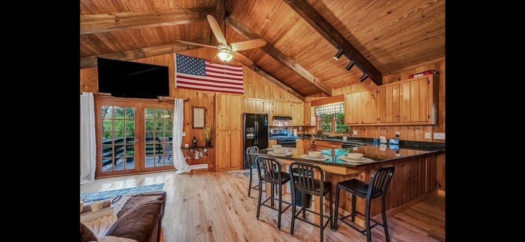 1828 East Otis Road Otis, MA 01029 - Photo 3 of 25 a dining room with furniture and wooden floor