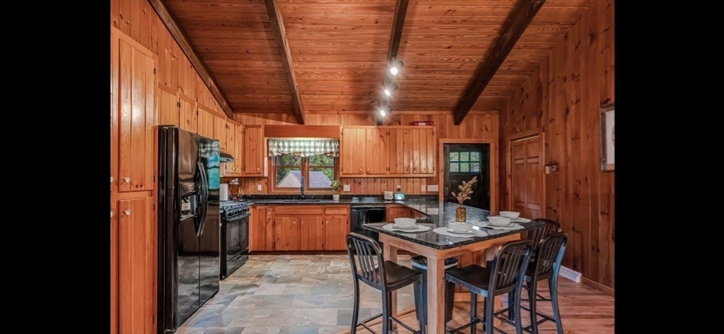 1828 East Otis Road Otis, MA 01029 - Photo 4 of 24 a kitchen with a table and chairs in it