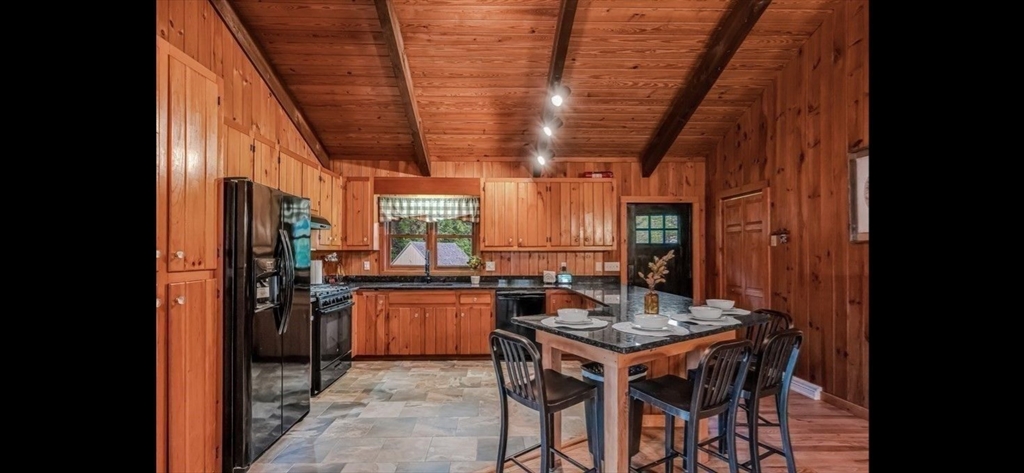 1828 East Otis Road Otis, MA 01029 - Photo 5 of 25 a kitchen with a table and chairs in it