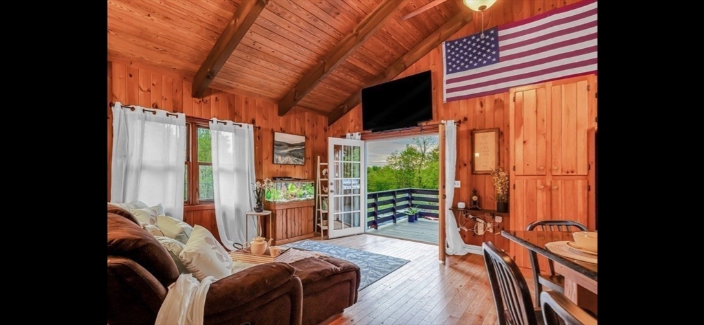 1828 East Otis Road Otis, MA 01029 - Photo 6 of 25 view of living room with furniture and large windows