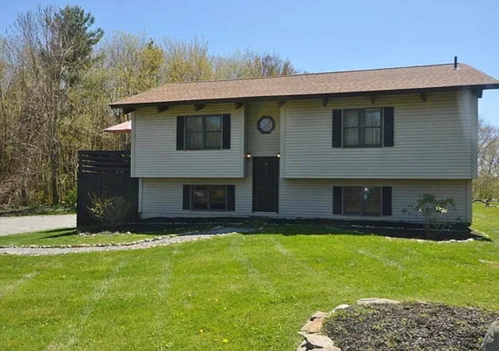 1828 East Otis Road Otis, MA 01029 - Photo 8 of 24 a front view of a house with a garden