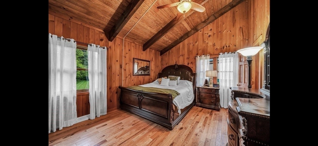 1828 East Otis Road Otis, MA 01029 - Photo 10 of 25 a bed sitting in a bedroom next to a window