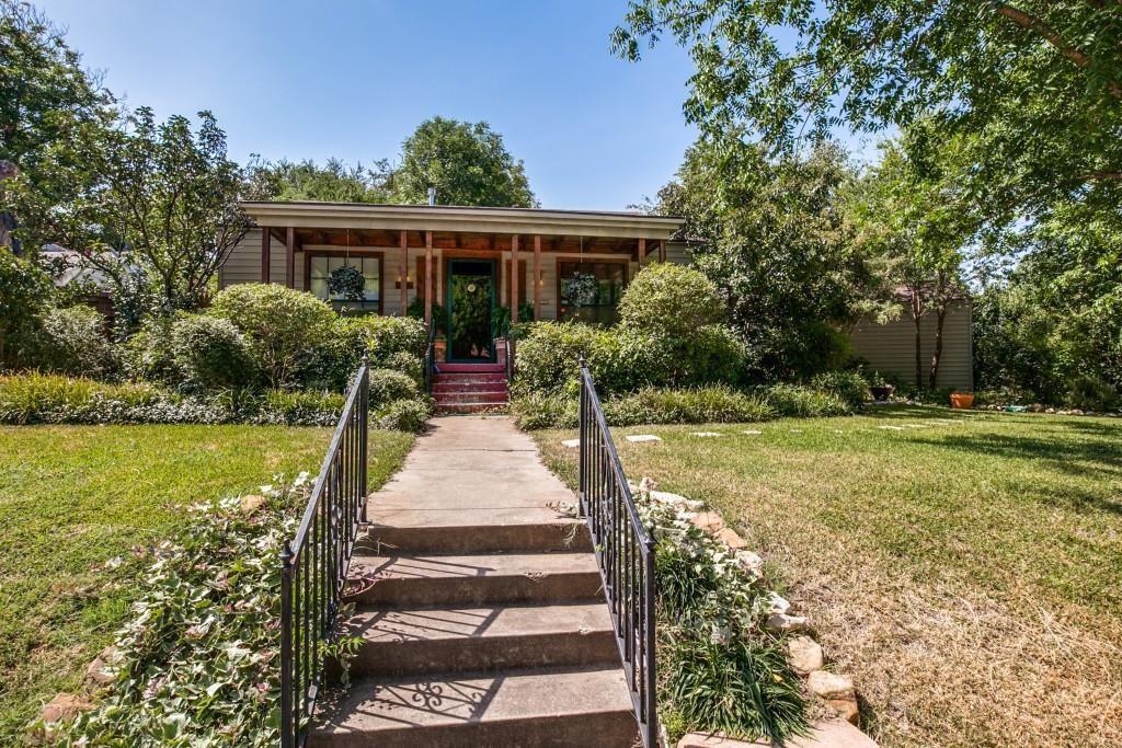 Undisclosed Address Fort Worth, TX 76103 - Photo 1 of 1 a front view of house with yard and green space