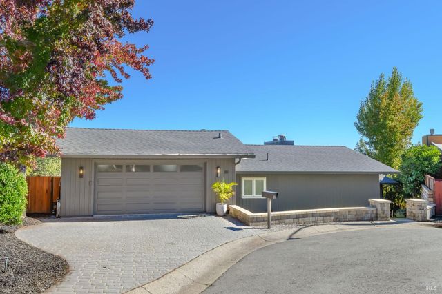 a front view of a house with a garage