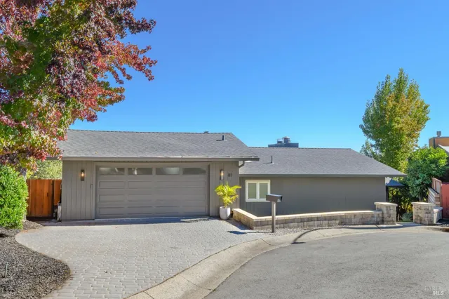 a front view of a house with a garage