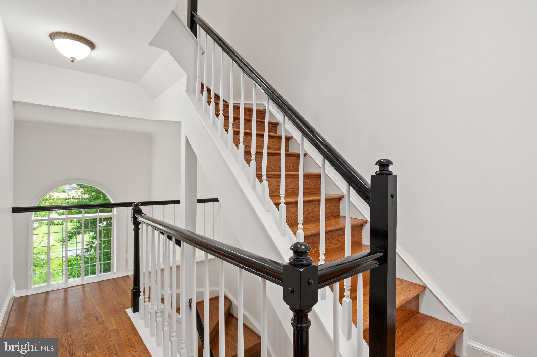 3729 Winfield Lane Northwest Washington, DC 20007 - Photo 11 of 22 a view of staircase with wooden floor and white walls