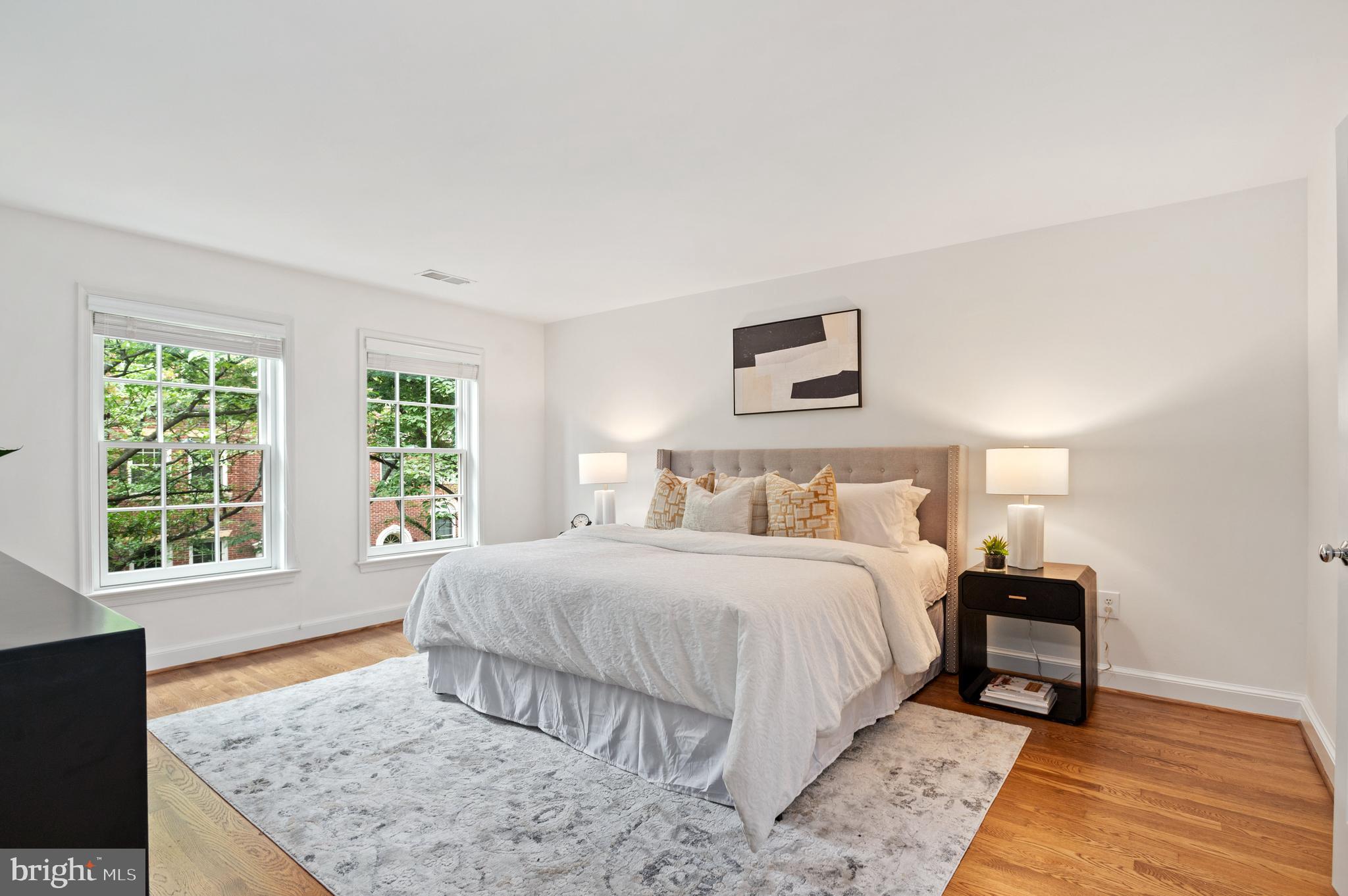 3729 Winfield Lane Northwest Washington, DC 20007 - Photo 12 of 22 a bedroom with a bed and wooden floor