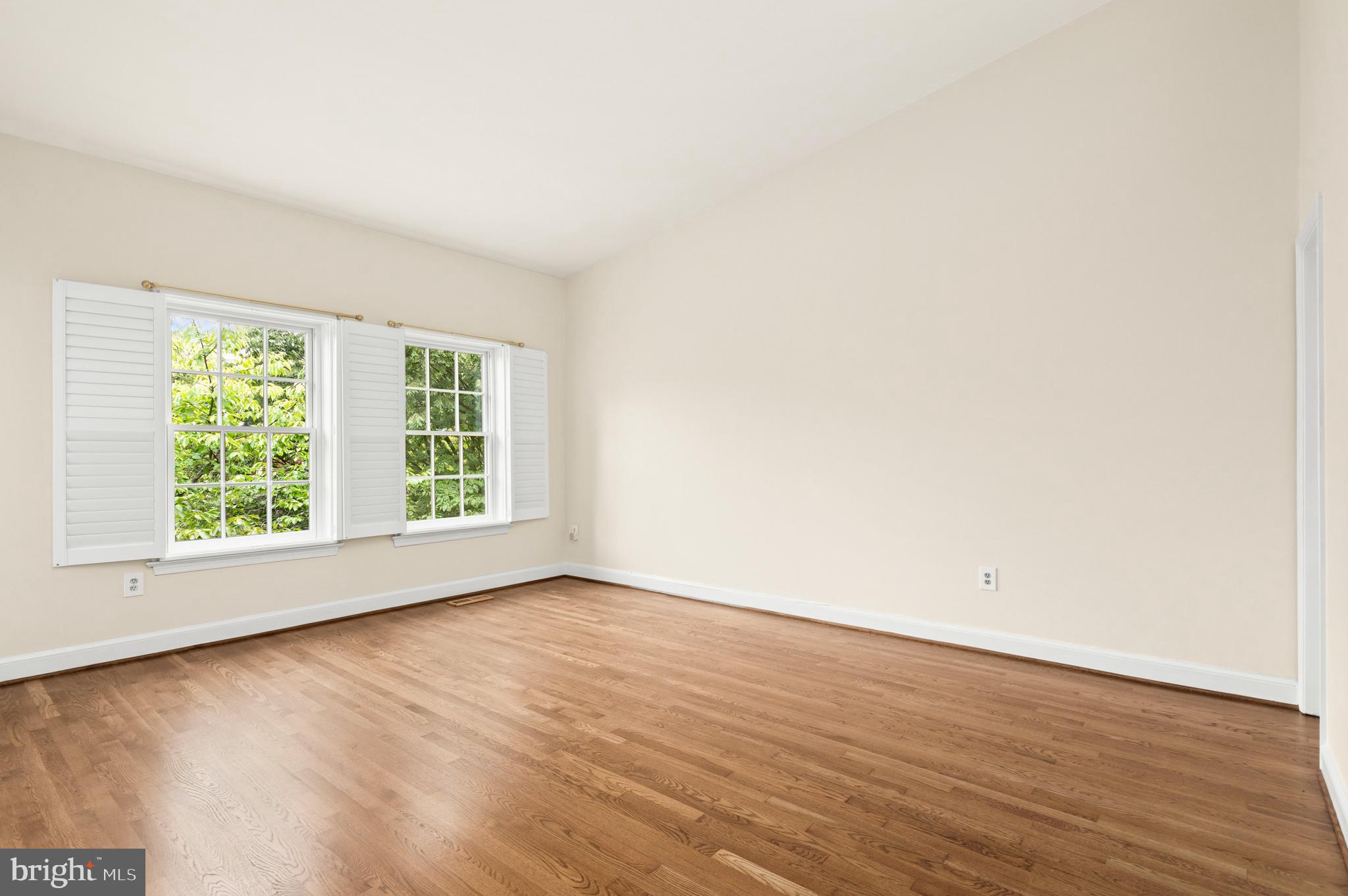 3729 Winfield Lane Northwest Washington, DC 20007 - Photo 15 of 22 an empty room with wooden floor and windows