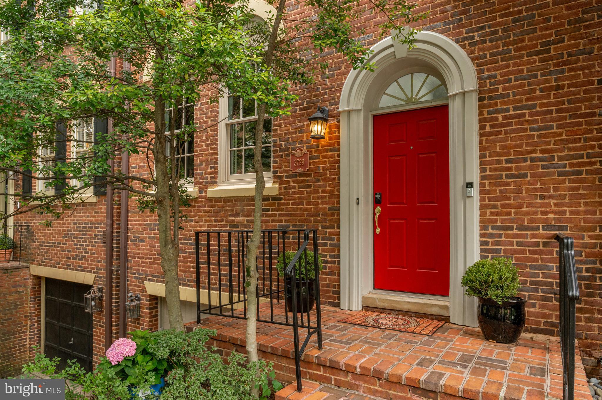 3729 Winfield Lane Northwest Washington, DC 20007 - Photo 3 of 22 a front view of a house with garden