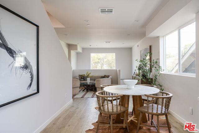 a view of a dining room with furniture and window
