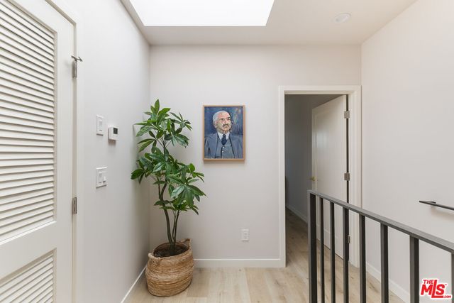 a vase of flowers sitting on a floor
