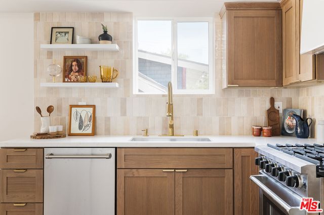 a kitchen with a stove and a sink