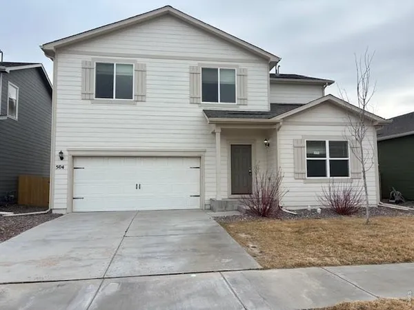 a view of house with backyard
