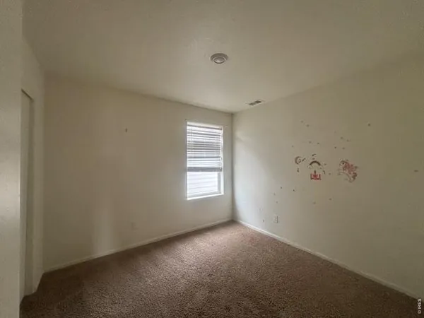 a view of empty room with windows