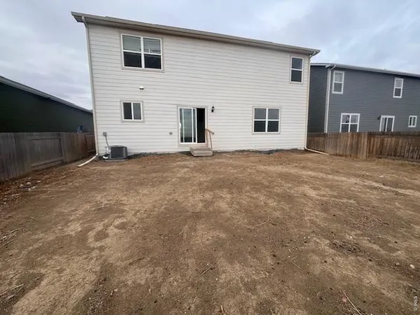 a view of an house with backyard and a window