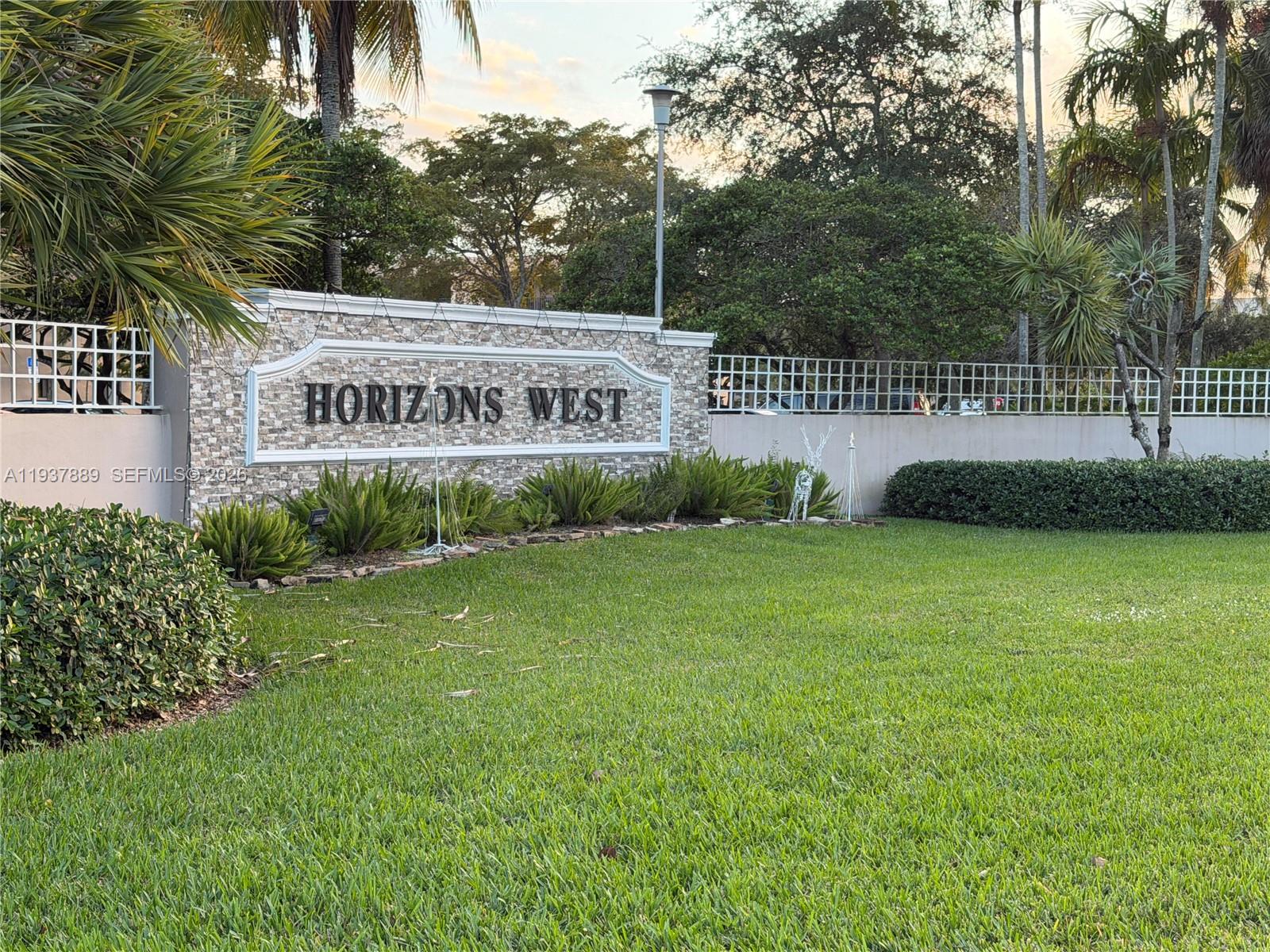 8500 Southwest 133rd Avenue Road, Unit 122 Miami, FL 33183 - Photo 2 of 22 a view of a house with a yard