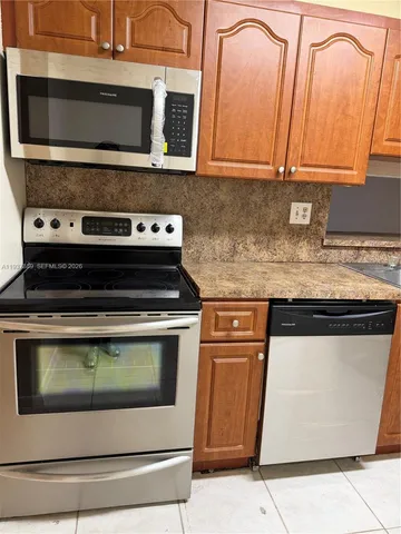 a bathroom with a sink toilet a mirror and shower