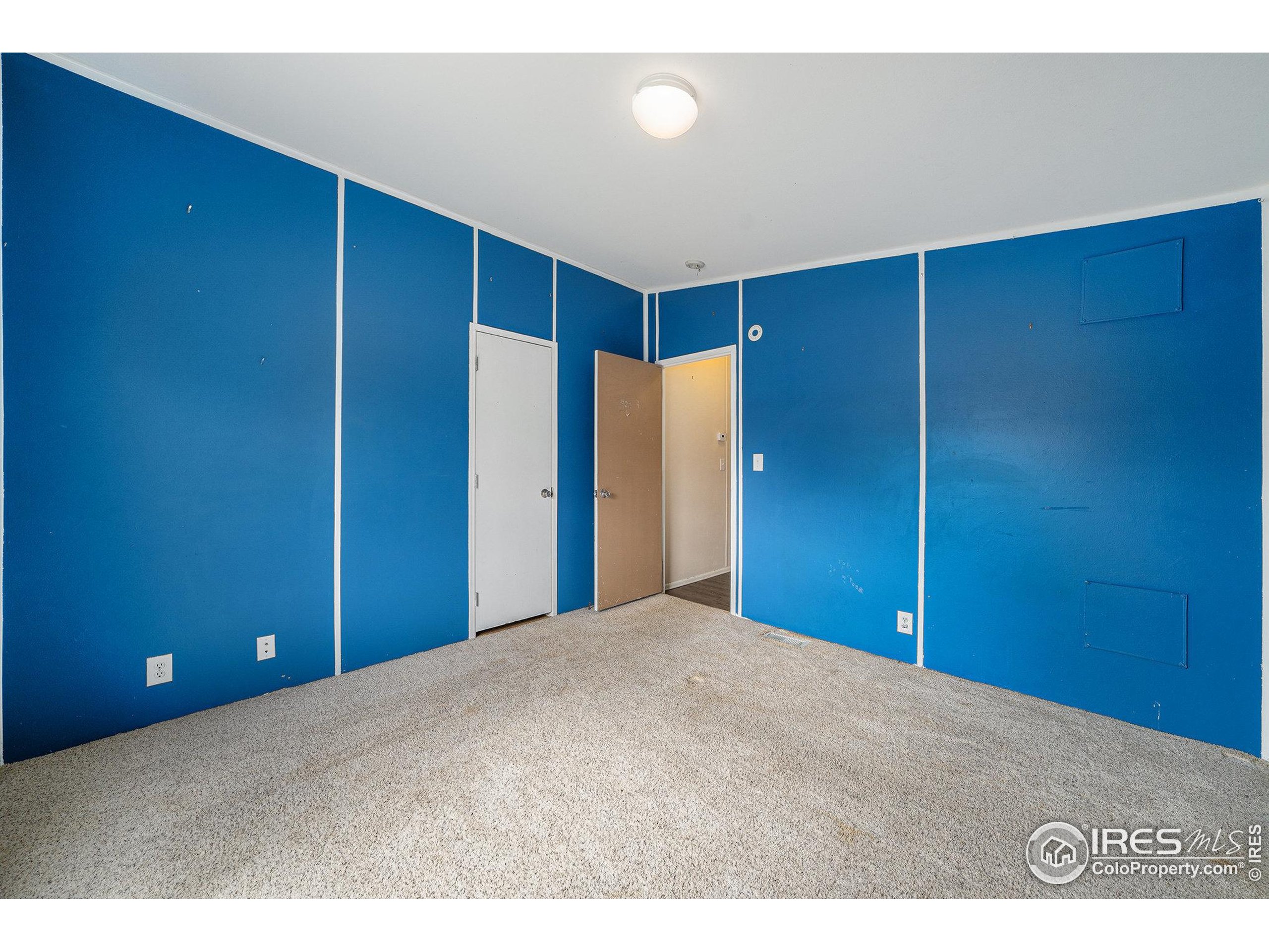 2500 East Harmony Road, Unit 191 Fort Collins, CO 80528 - Photo 14 of 22 a view of an empty room with wooden floor