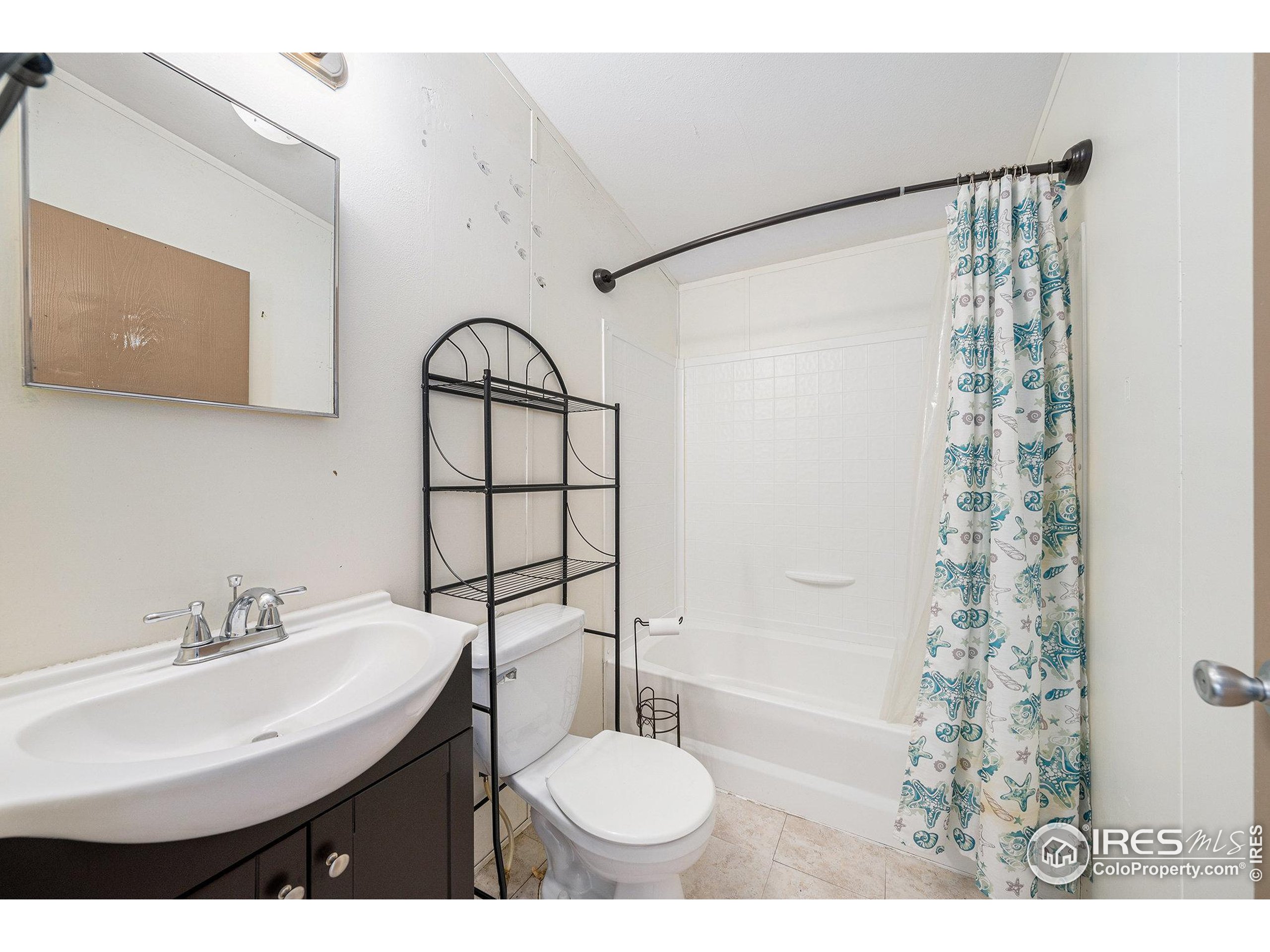 2500 East Harmony Road, Unit 191 Fort Collins, CO 80528 - Photo 17 of 22 a bathroom with a sink and a mirror