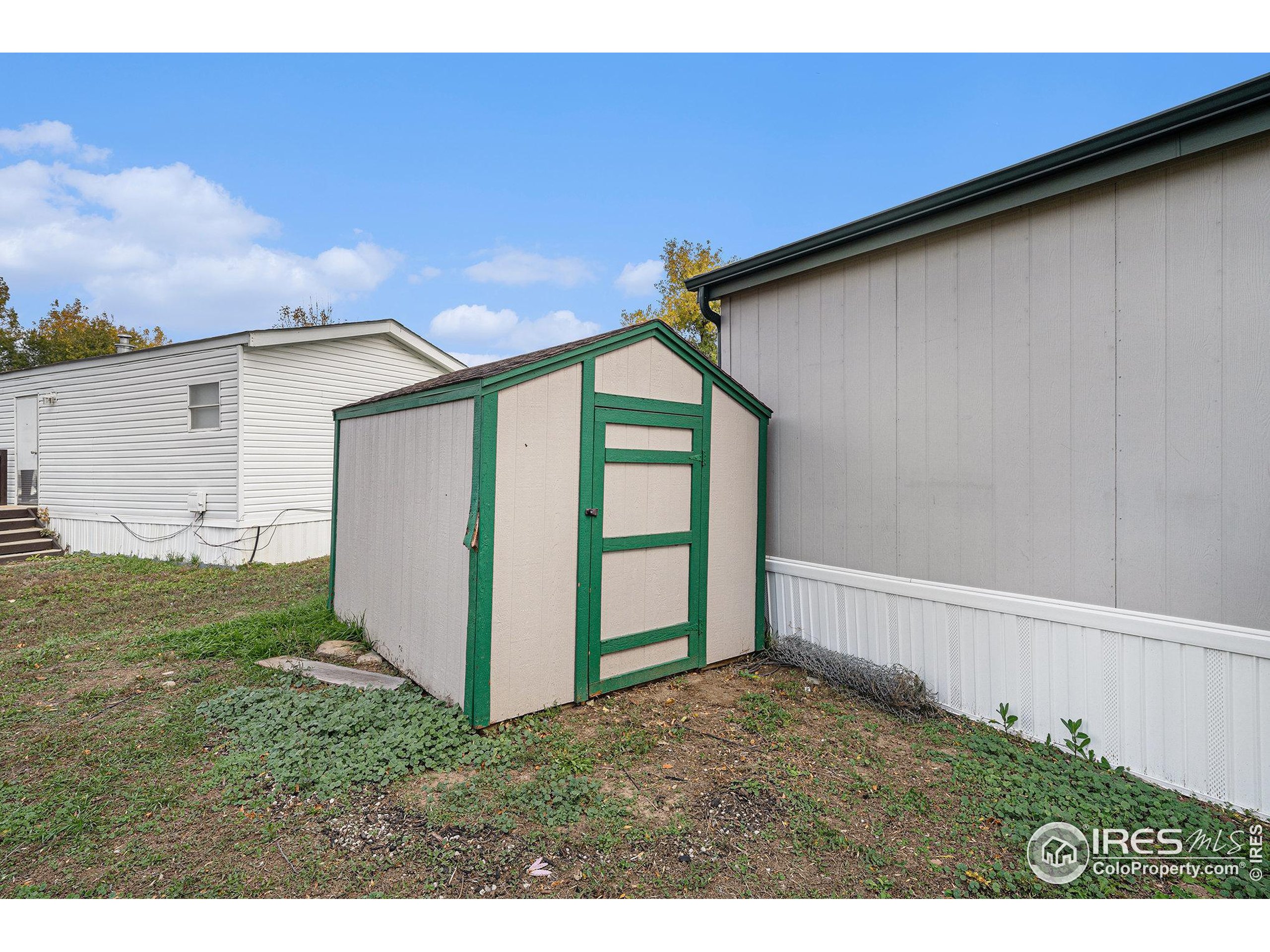 2500 East Harmony Road, Unit 191 Fort Collins, CO 80528 - Photo 19 of 22 a backyard of a house with lots of green space