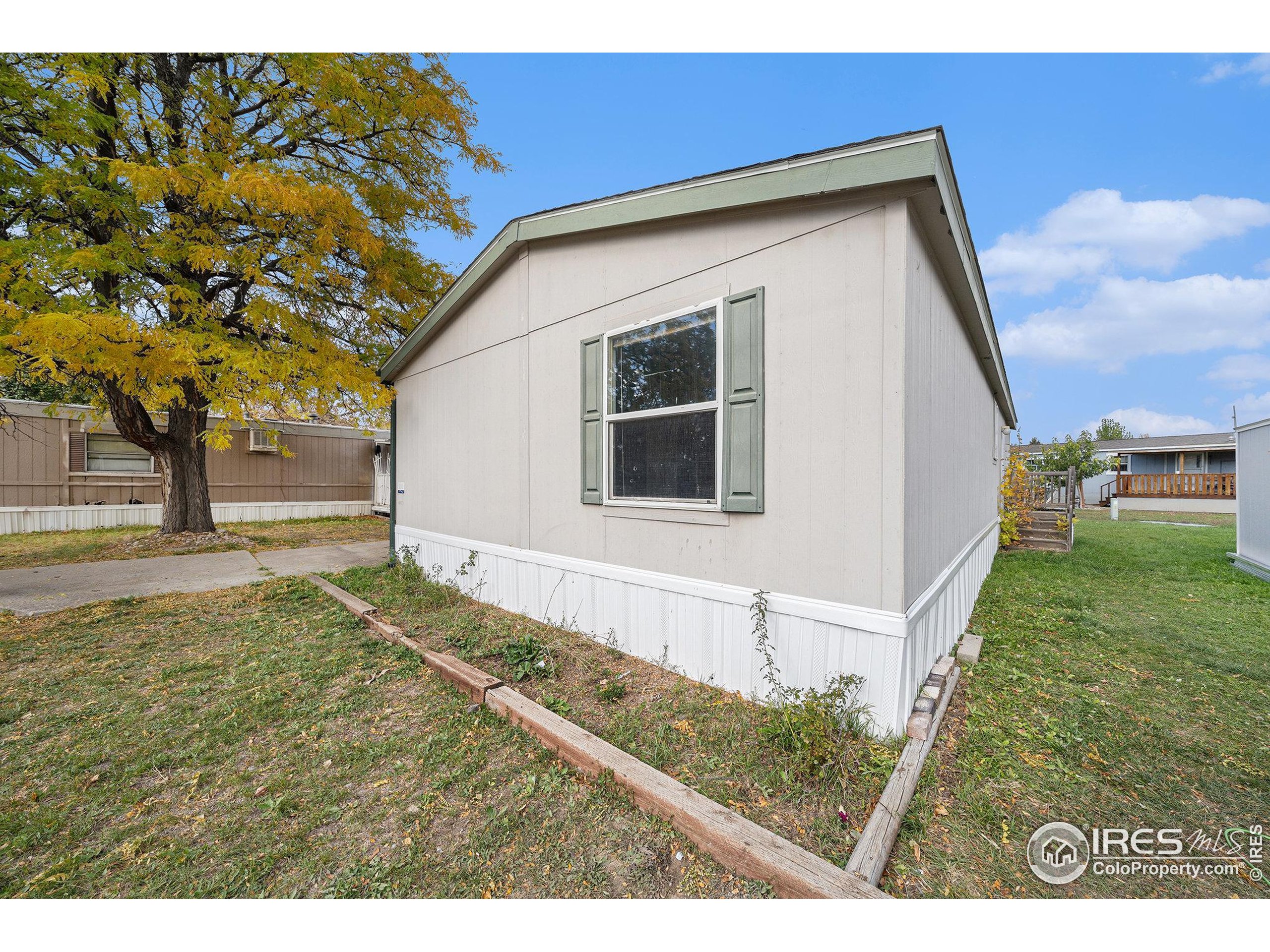 2500 East Harmony Road, Unit 191 Fort Collins, CO 80528 - Photo 21 of 22 a view of house with backyard