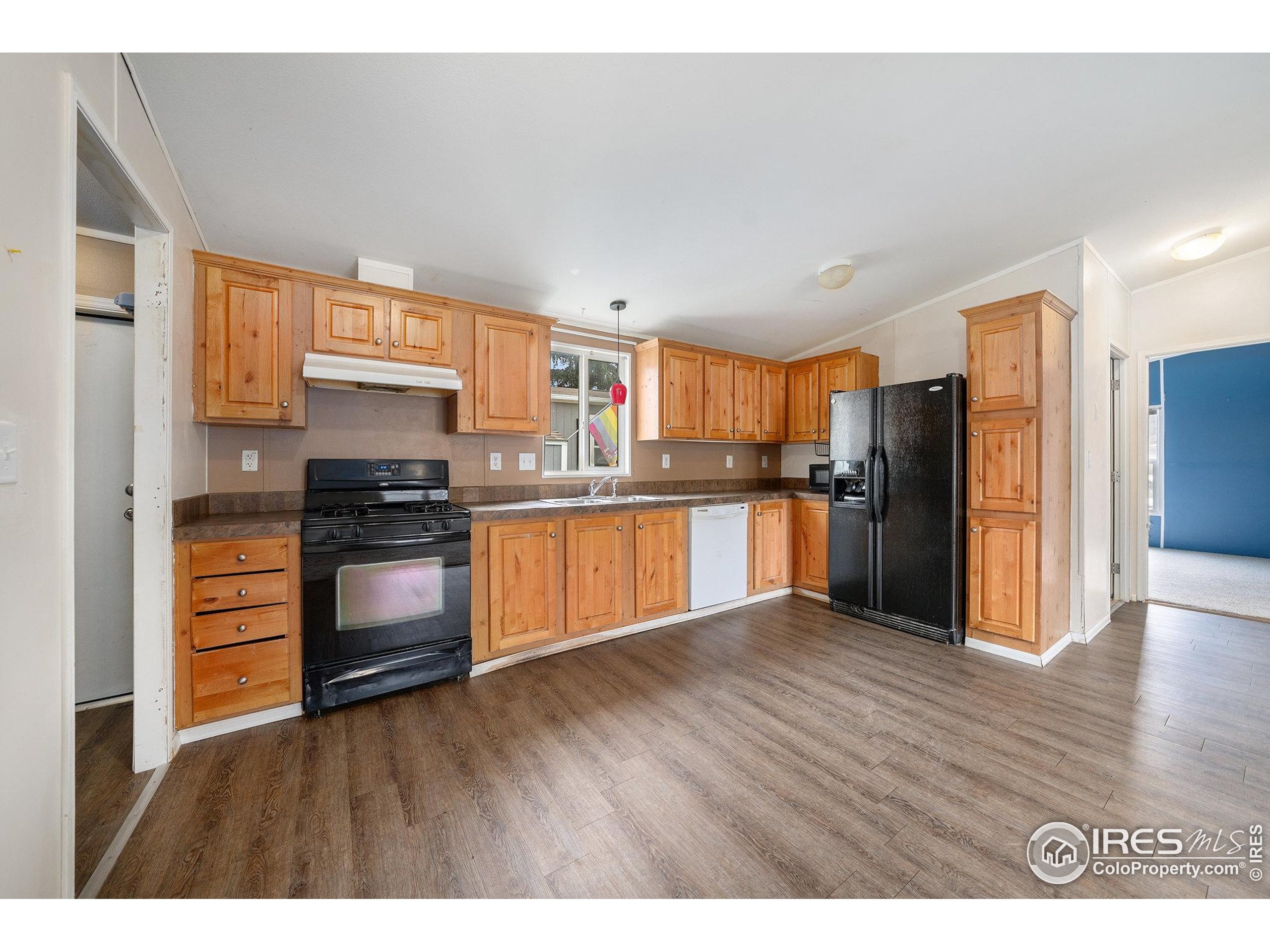 2500 East Harmony Road, Unit 191 Fort Collins, CO 80528 - Photo 5 of 22 a kitchen with granite countertop stainless steel appliances and refrigerator
