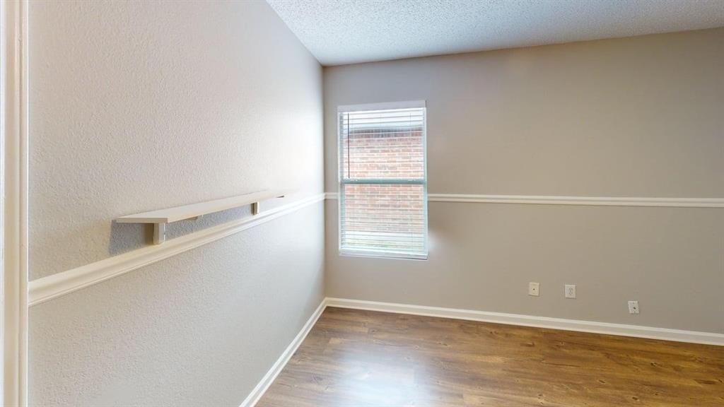 1505 Stewart Drive Rockwall, TX 75032 - Photo 11 of 20 a view of an empty room with a window