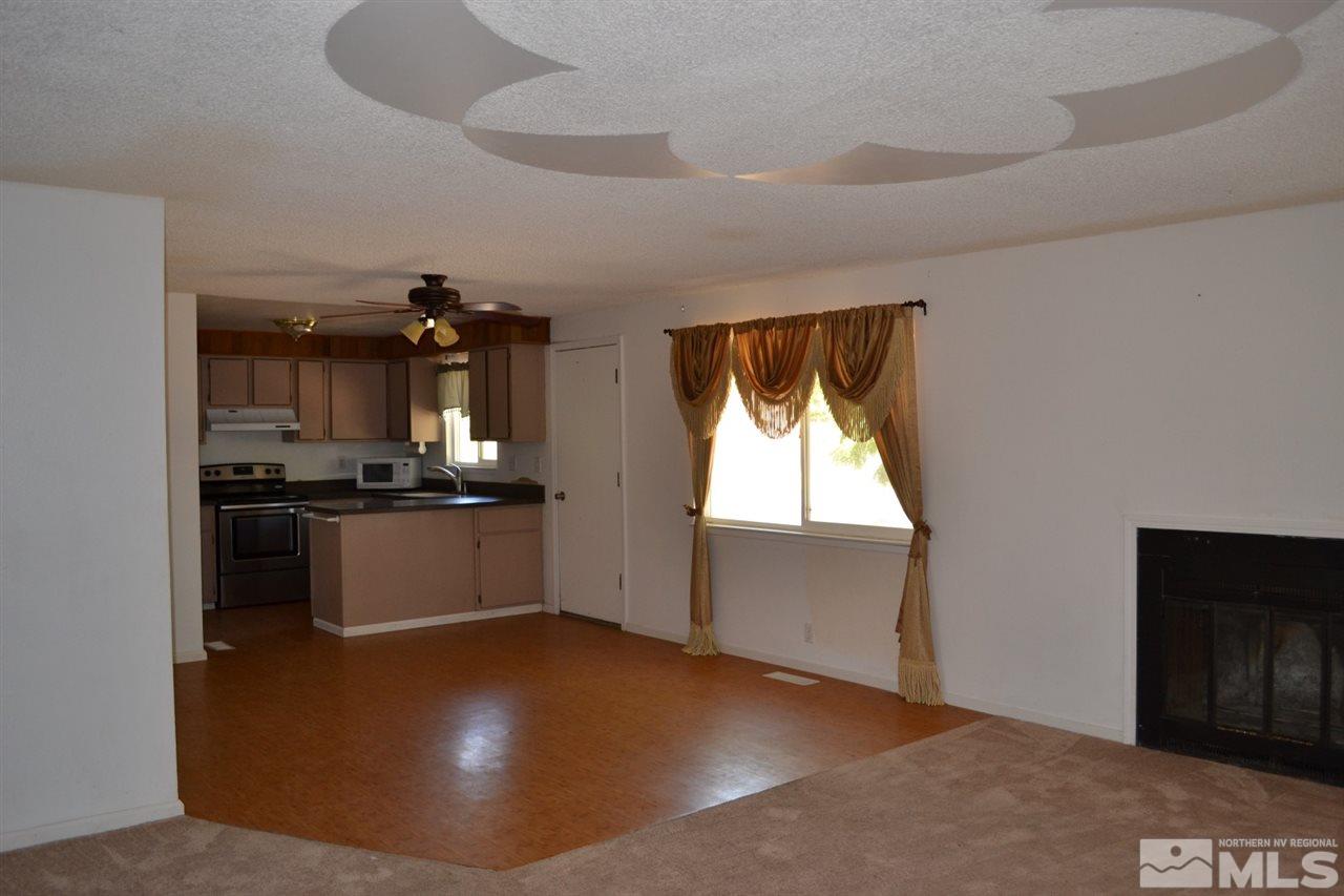 127 Ring Road Dayton, NV 89403 - Photo 3 of 24 a view of a kitchen with a sink and dishwasher
