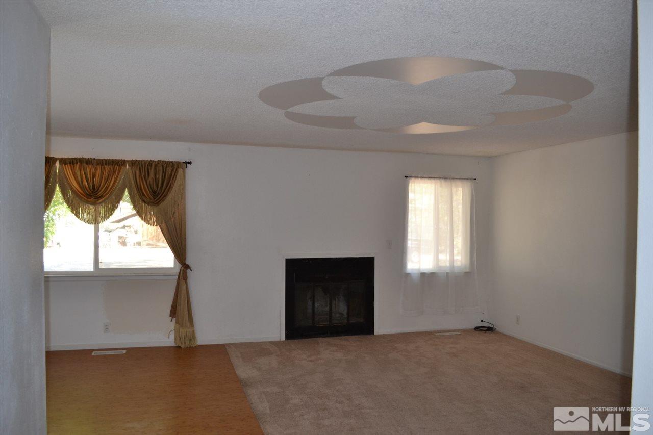 127 Ring Road Dayton, NV 89403 - Photo 4 of 24 an empty room with windows