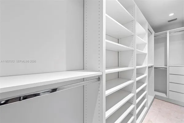 a view of an empty walk in closet