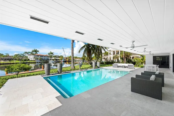 a view of a swimming pool and lounge chair