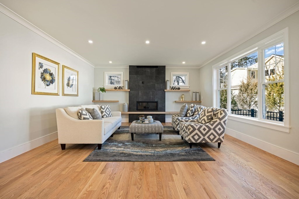 216 Concord Avenue Lexington, MA 02421 - Photo 3 of 7 a living room with furniture and a large window