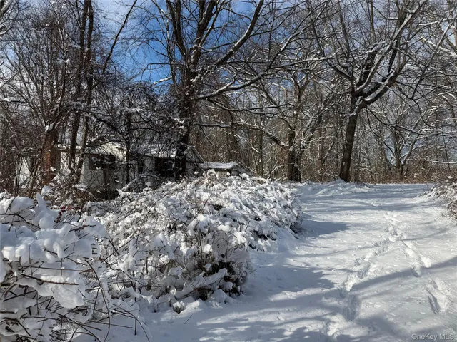 a view of snow on a road