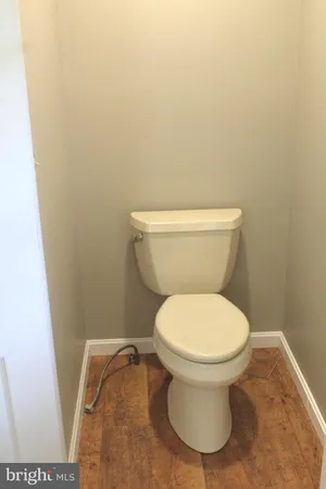 a white toilet sitting next to a sink