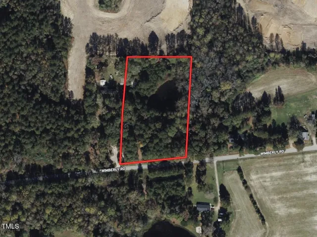 a view of a pathway with a house and a park