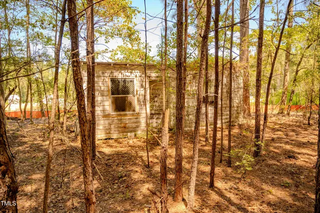 an aerial view of a house with a yard and outdoor space