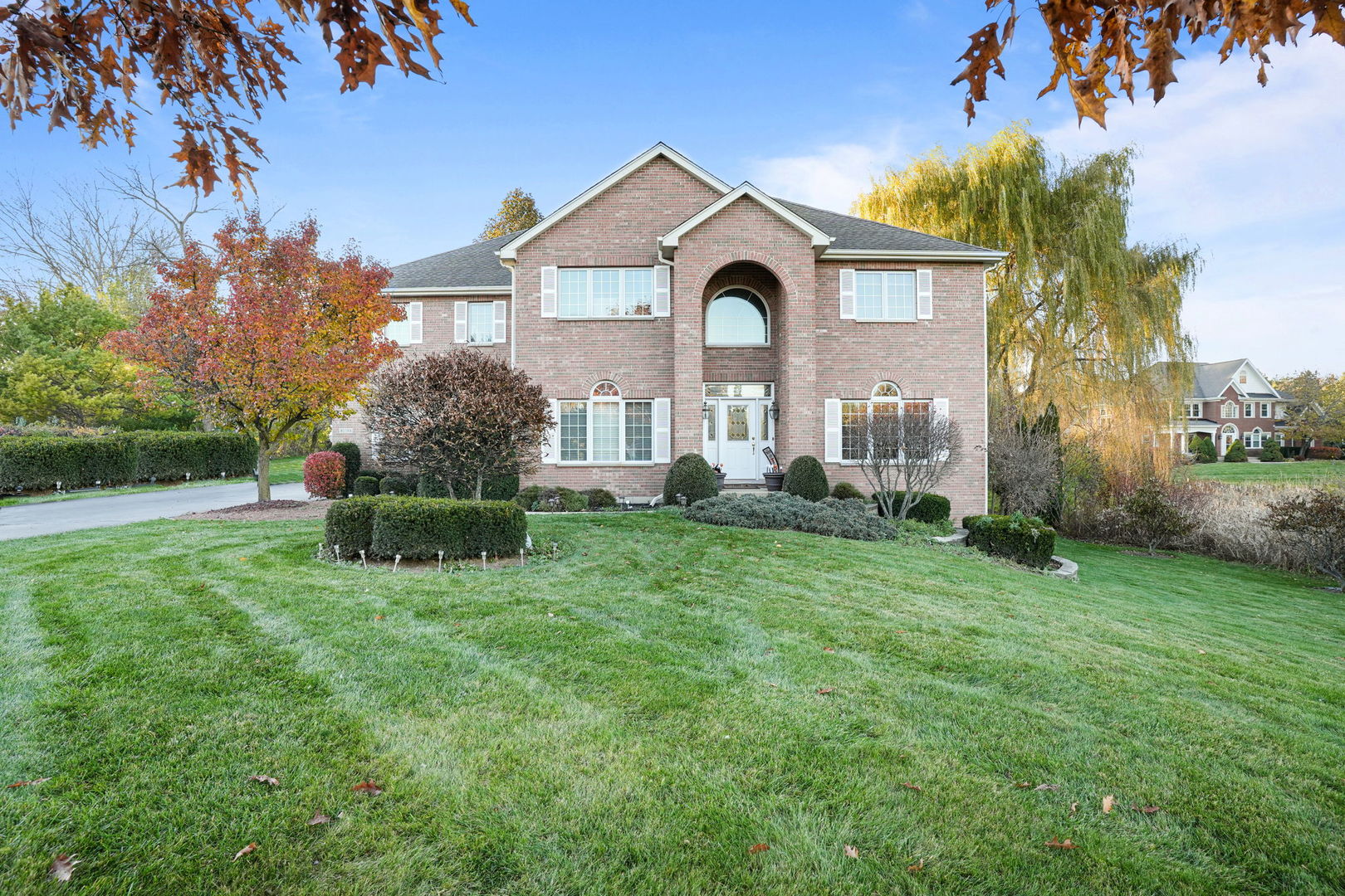 40388 Reed Court Wadsworth, IL 60083 - Photo 1 of 30 a front view of a house with a yard and potted plants