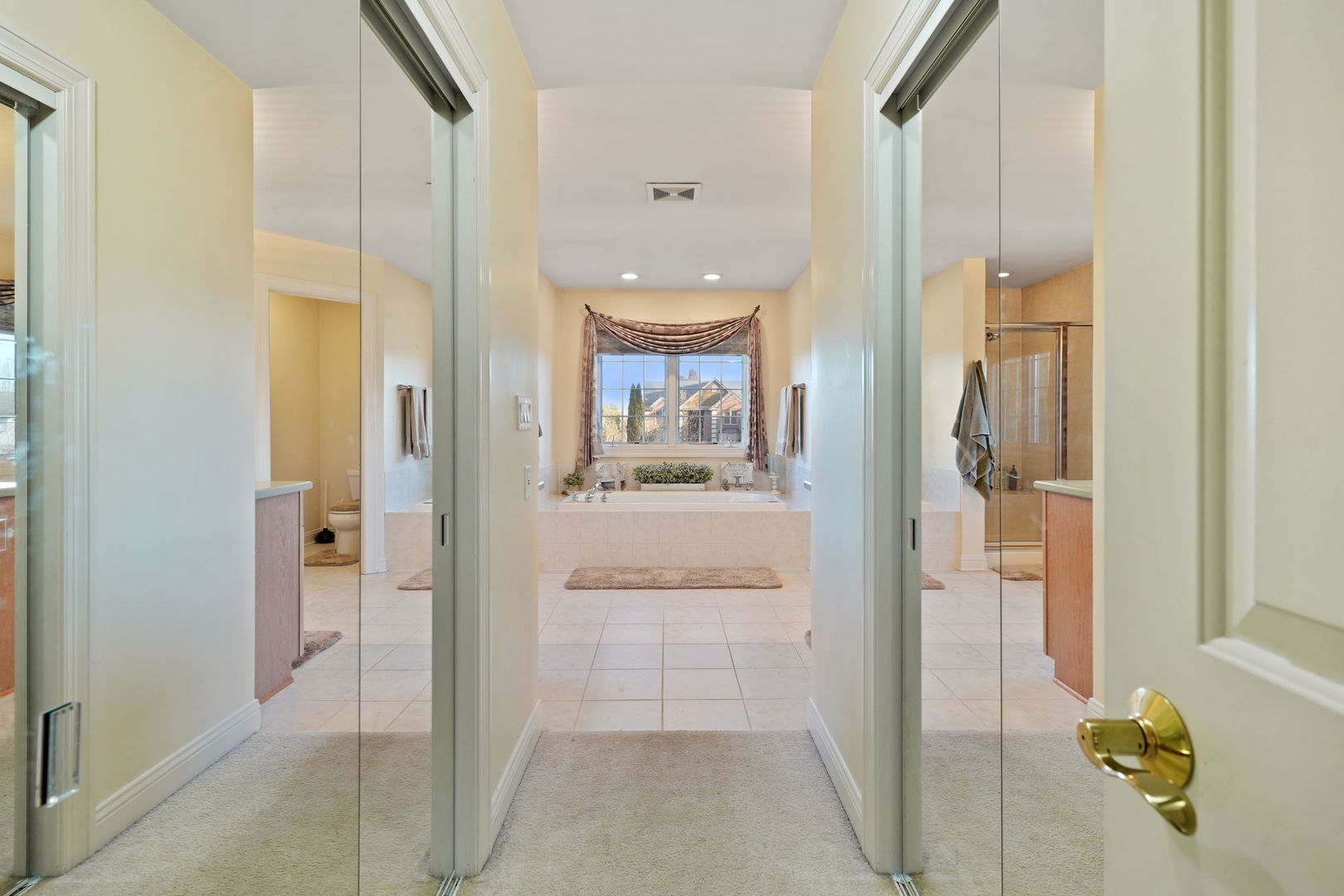 40388 Reed Court Wadsworth, IL 60083 - Photo 13 of 30 a view of a hallway with wooden floor windows and a bathroom