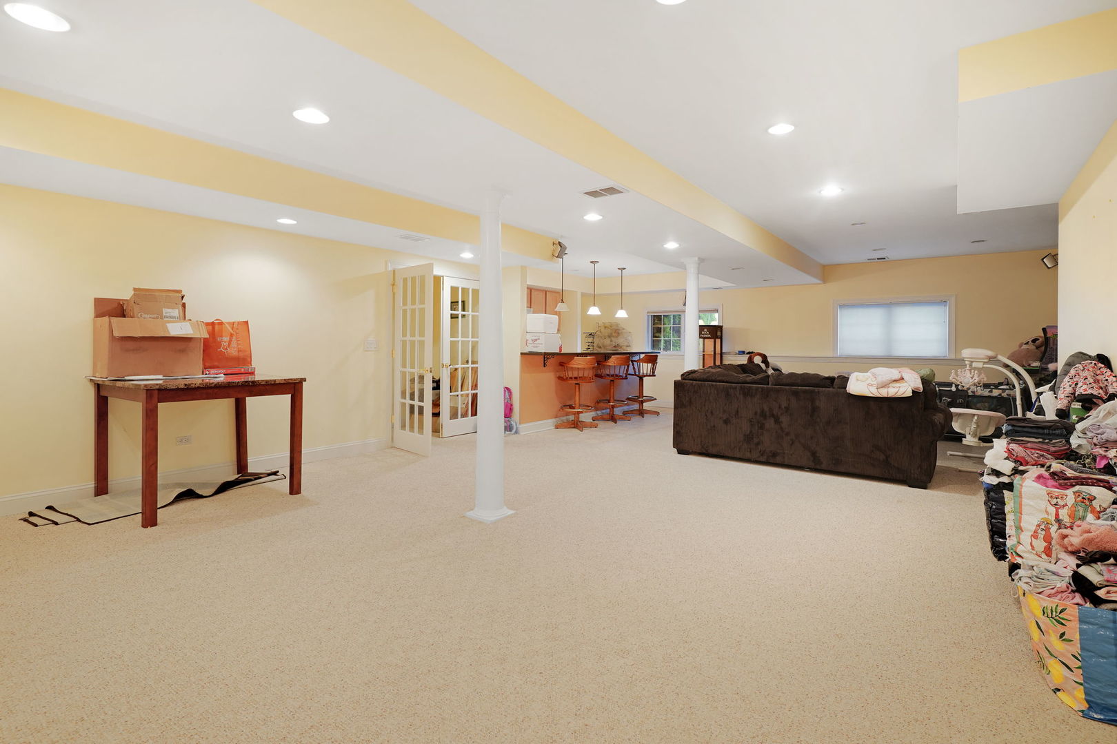 40388 Reed Court Wadsworth, IL 60083 - Photo 17 of 30 a large white room with a large window and a table chair