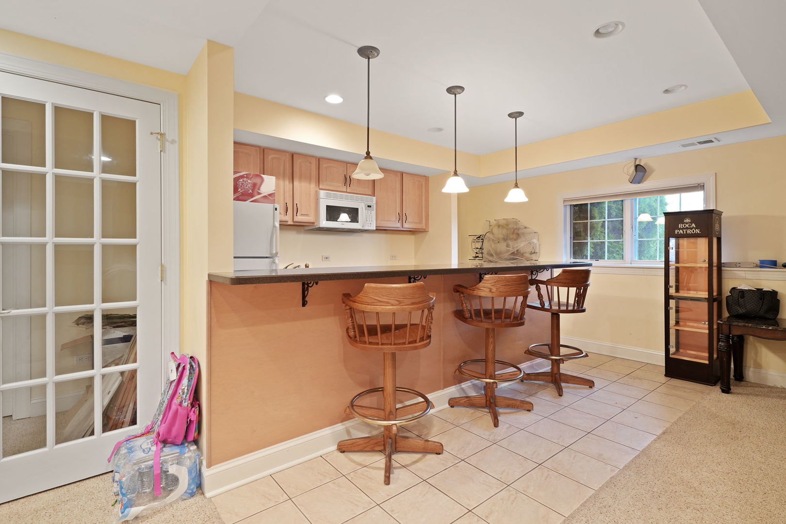 40388 Reed Court Wadsworth, IL 60083 - Photo 18 of 30 a view of a kitchen with kitchen island dining table and chairs