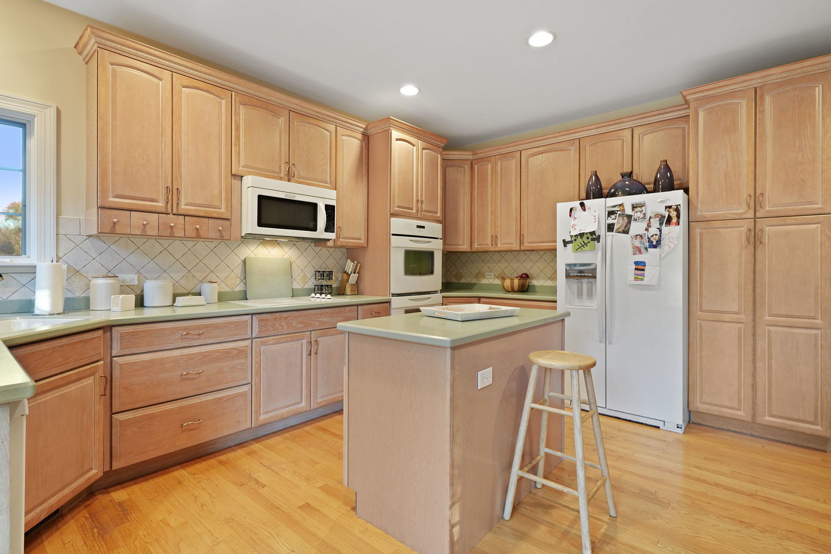 40388 Reed Court Wadsworth, IL 60083 - Photo 21 of 30 a kitchen with granite countertop a refrigerator stove top oven and sink