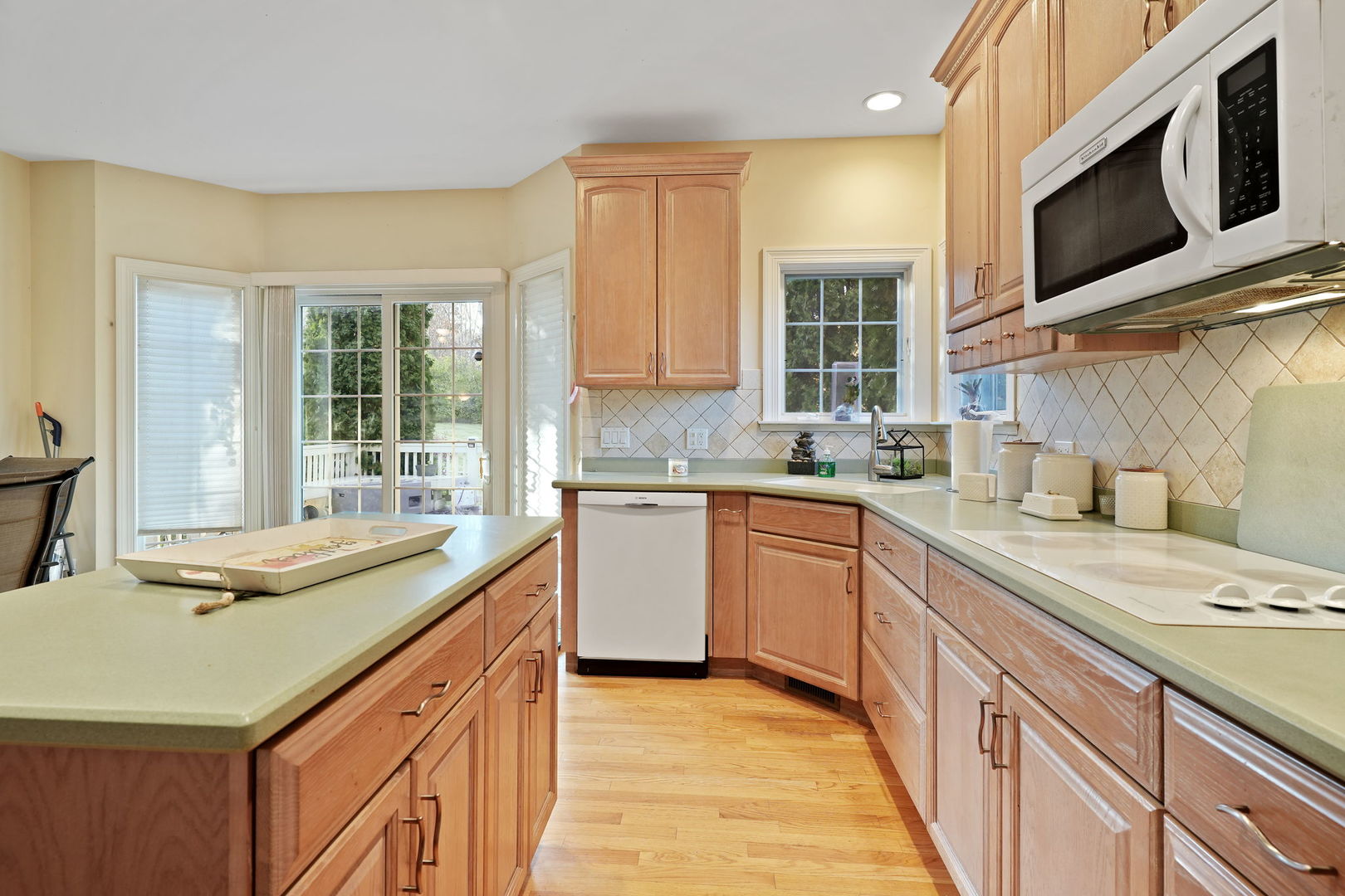 40388 Reed Court Wadsworth, IL 60083 - Photo 6 of 30 a kitchen with stainless steel appliances granite countertop a sink and microwave