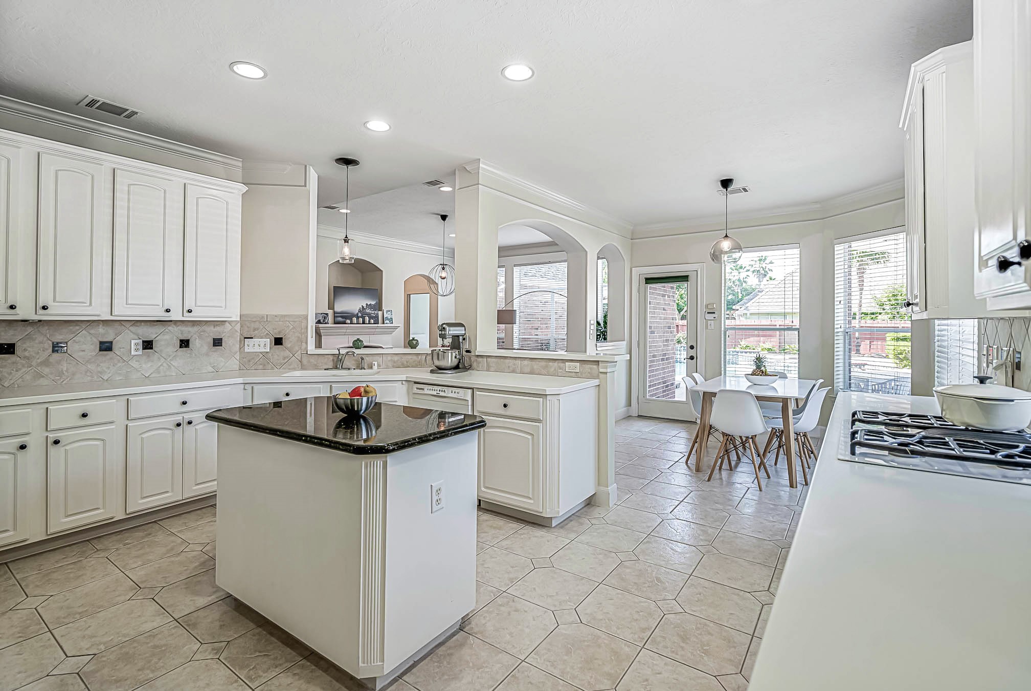 5103 Mariner's Harbor Houston, TX 77041 - Photo 6 of 42 Open floor concept for this white cabinetry kitchen