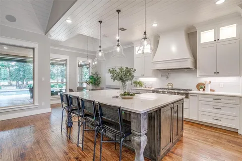 a kitchen with a table and chairs in it